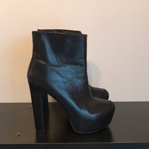 Shiny black platform boots